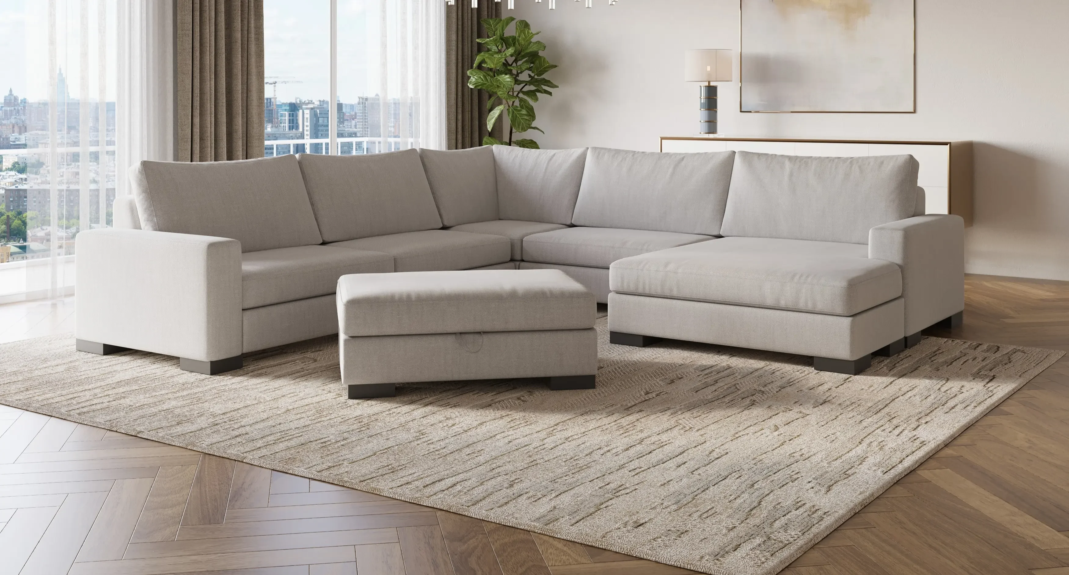L-shaped Zen modular sectional with matching ottoman in a contemporary living room with herringbone wood floor