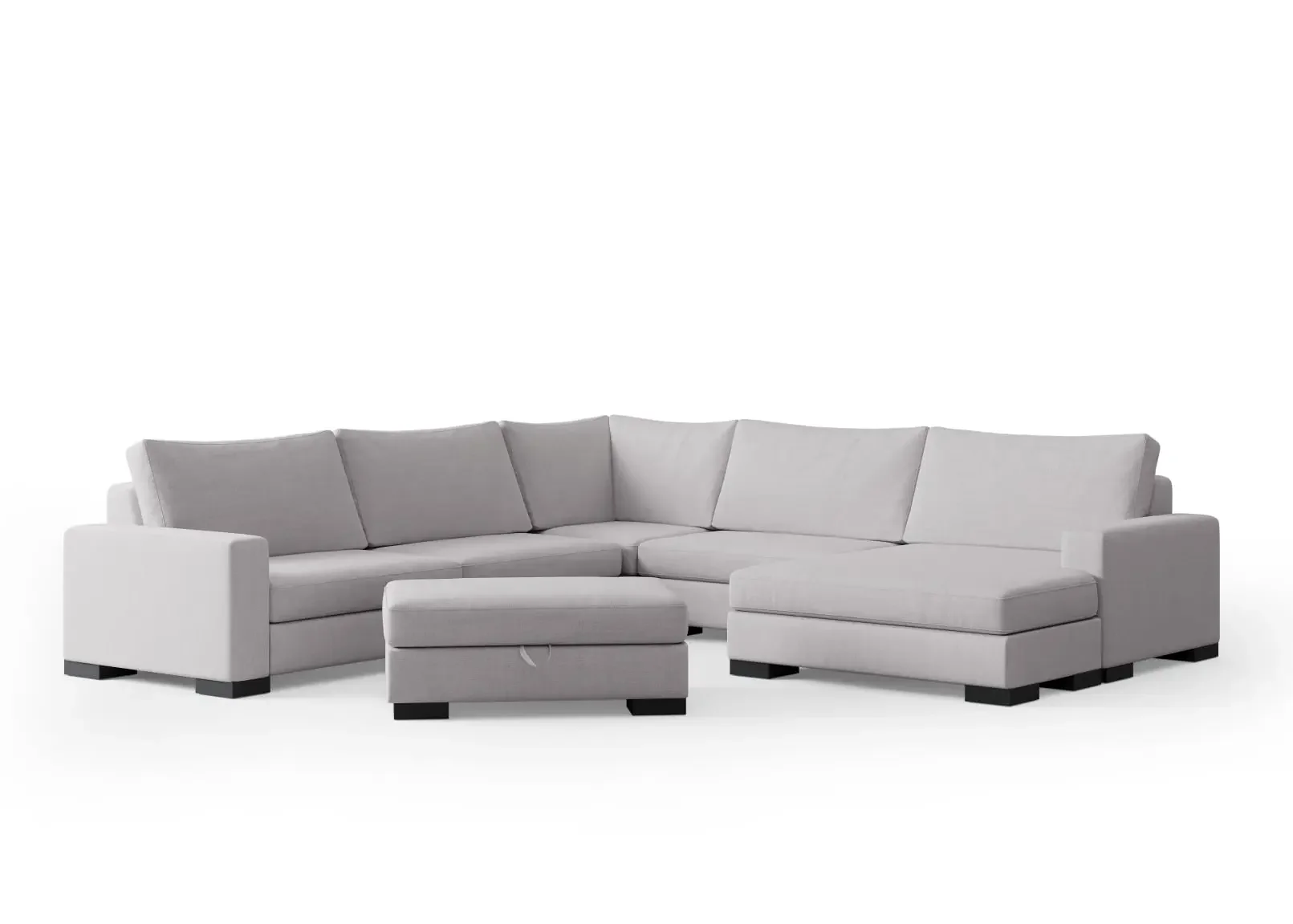 Large U-shaped modular sectional sofa with a separate storage ottoman in light gray fabric