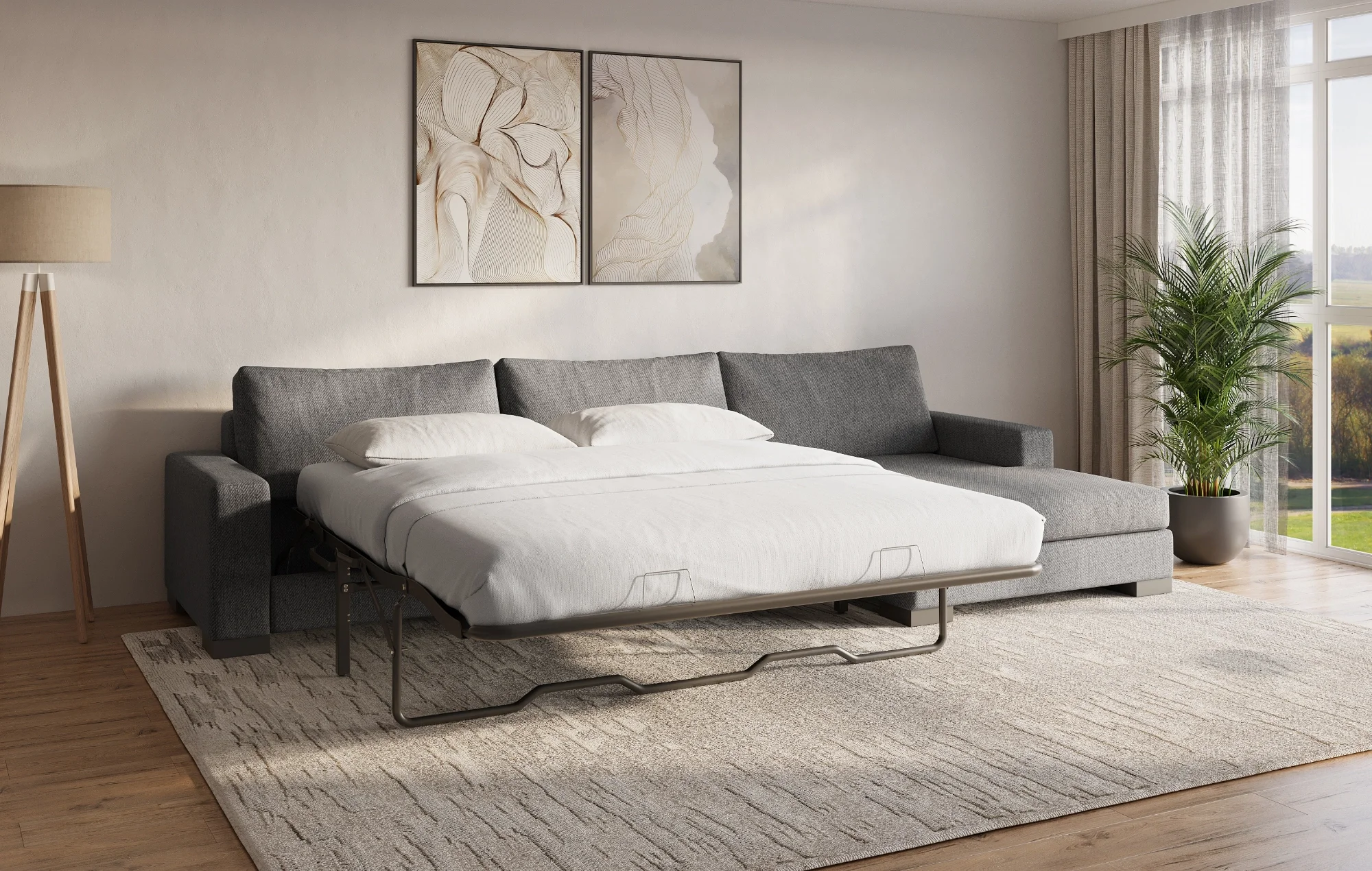 Extended sofa bed in a bright modern living room with framed art and large windows